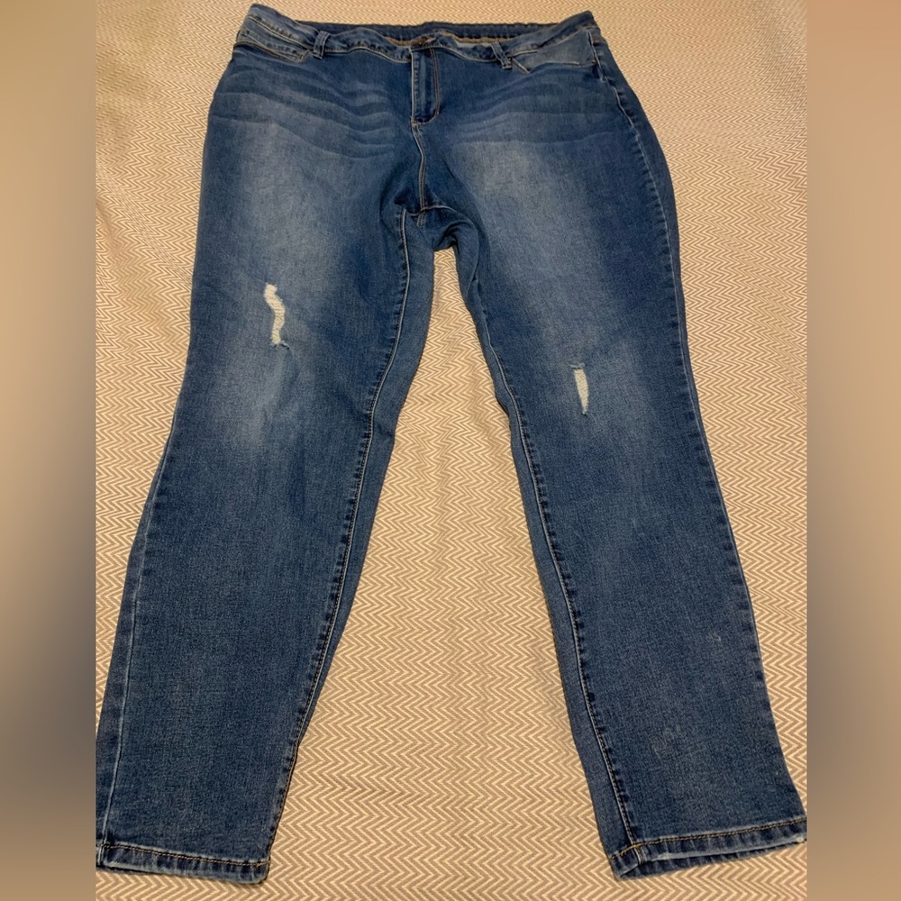 YMI skinny jeans with slight distressing.  Medium wash. Stretchy. Size 20.